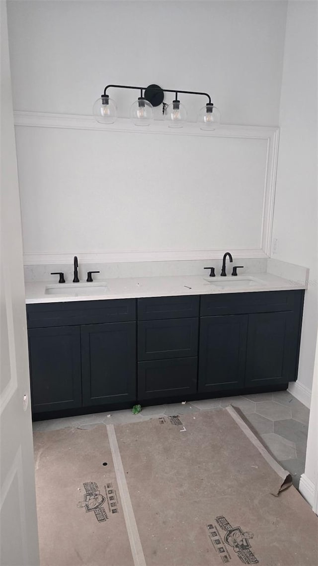 bathroom featuring double vanity and a sink