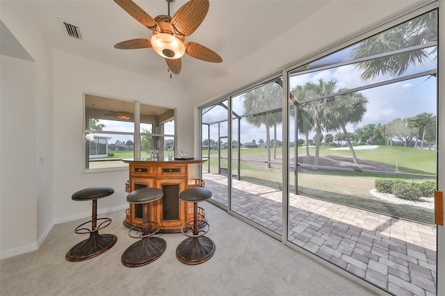 sunroom with ceiling fan