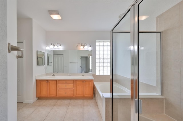 bathroom with tile floors, large vanity, shower with separate bathtub, and dual sinks