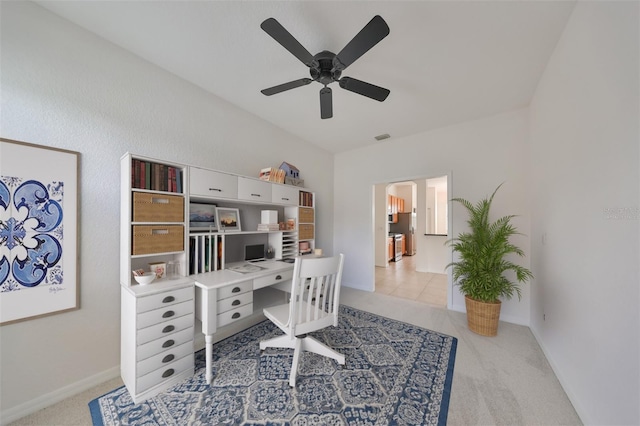 office with ceiling fan and light tile floors