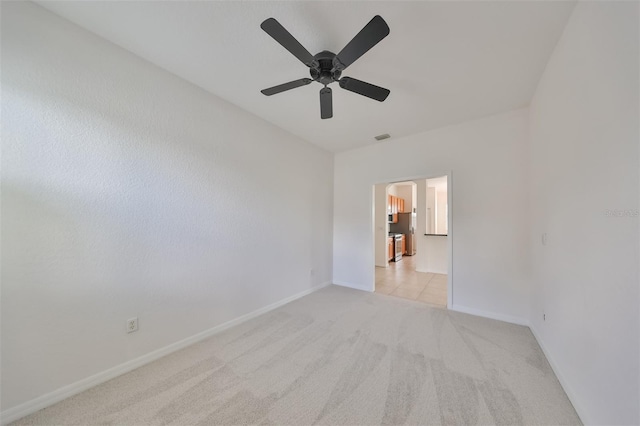 carpeted empty room with ceiling fan