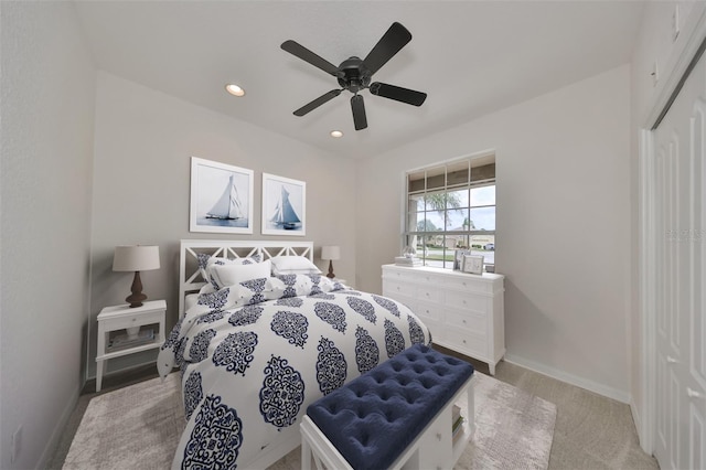 carpeted bedroom with a closet and ceiling fan