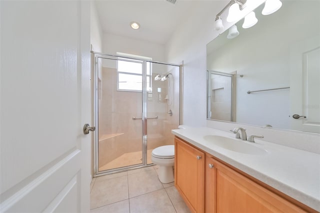 bathroom with tile flooring, an enclosed shower, toilet, and vanity