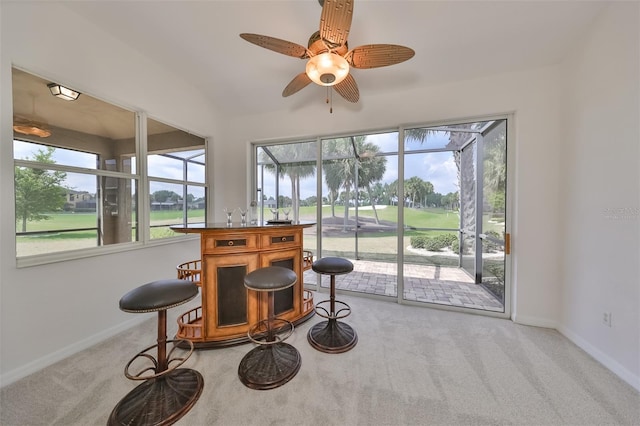 sitting room with light colored carpet and ceiling fan