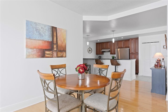 dining room with light tile floors