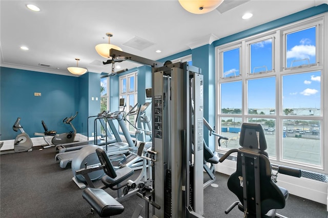 exercise room with ornamental molding