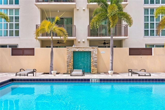 view of pool with ceiling fan