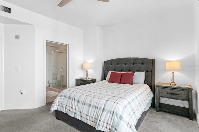 bedroom featuring a walk in closet, a closet, carpet floors, and ceiling fan