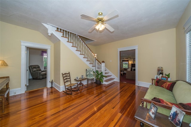 living room featuring a healthy amount of sunlight, ceiling fan, and hardwood / wood-style floors