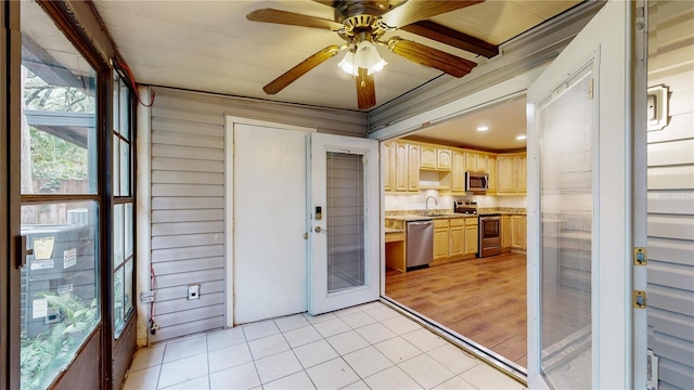 sunroom featuring sink and ceiling fan