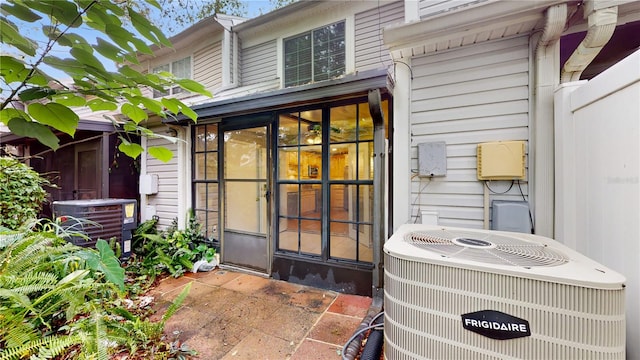 entrance to property featuring central air condition unit