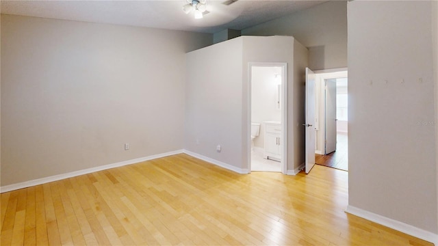 empty room featuring ceiling fan and light hardwood / wood-style floors