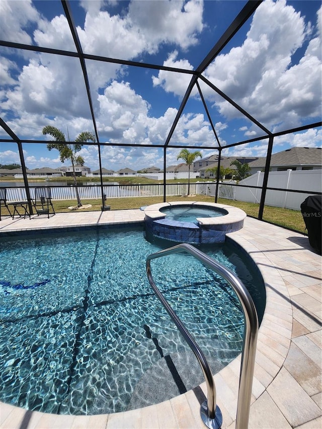 view of swimming pool with a water view, an in ground hot tub, a patio, and a lanai