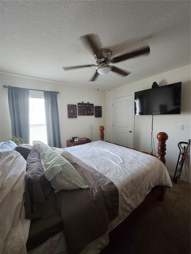 bedroom featuring a textured ceiling, ceiling fan, and carpet floors