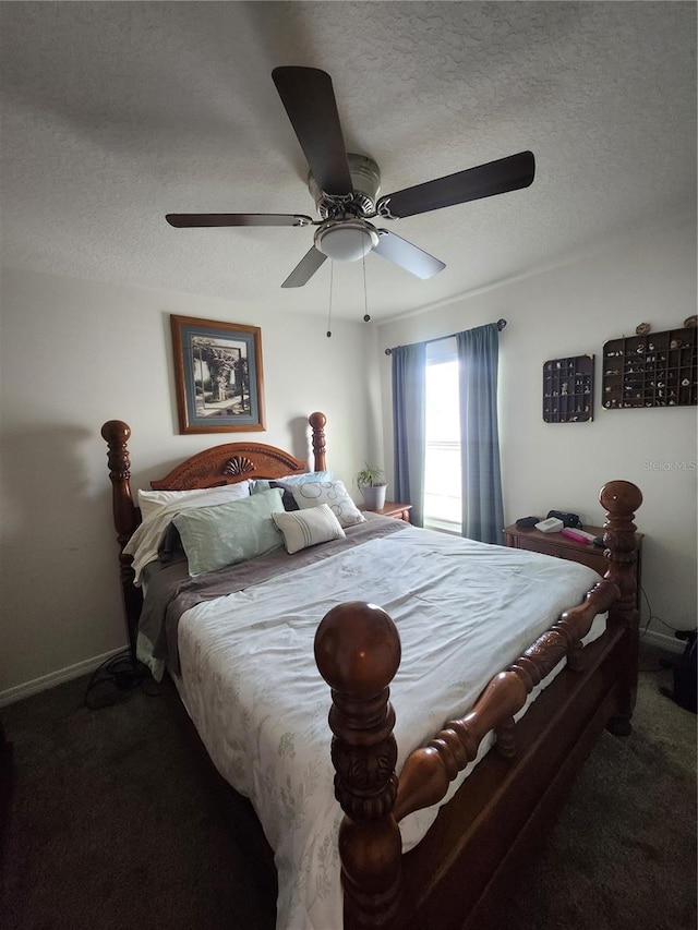 carpeted bedroom with ceiling fan and a textured ceiling