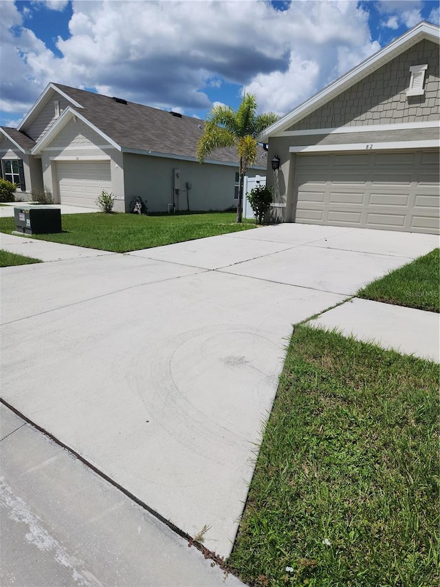 view of home's exterior featuring a yard and a garage