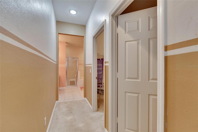 corridor with light colored carpet