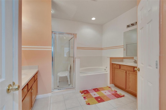 bathroom with tile floors, plus walk in shower, and vanity