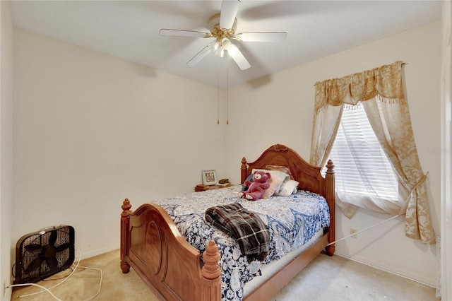 bedroom with ceiling fan and carpet floors