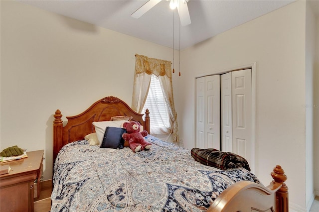 bedroom with a closet, ceiling fan, and hardwood / wood-style floors