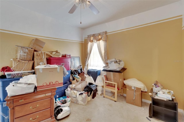 interior space with ceiling fan and carpet floors