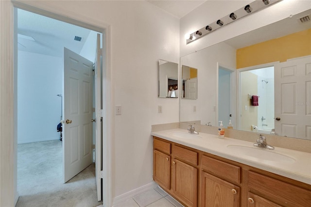 bathroom with dual vanity and tile flooring