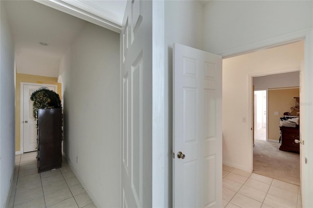 hallway featuring light tile floors