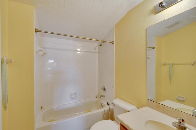 full bathroom with a textured ceiling, tiled shower / bath combo, vanity, and toilet