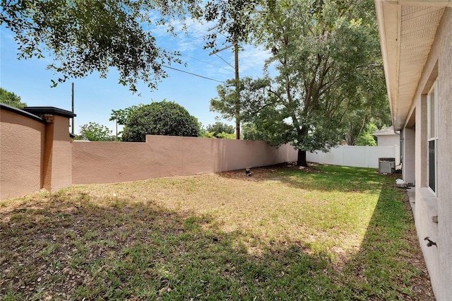 view of yard with central AC