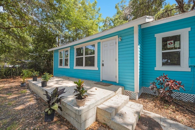 doorway to property featuring a patio