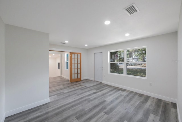 unfurnished room featuring hardwood / wood-style floors