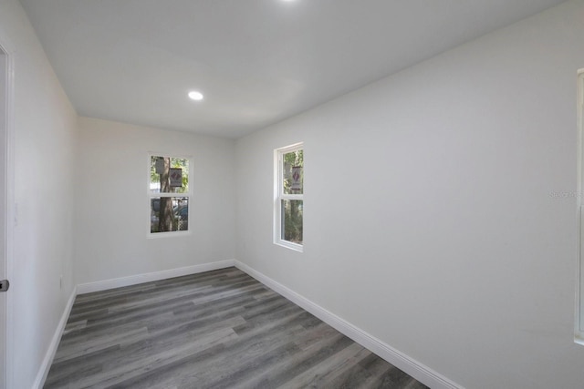 spare room featuring dark hardwood / wood-style flooring