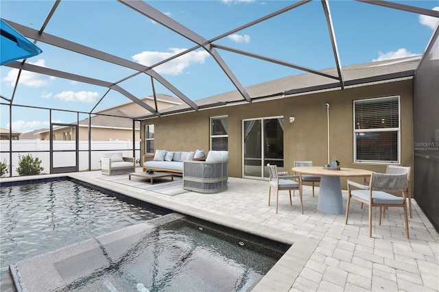 view of swimming pool with a patio, an outdoor hangout area, and a lanai