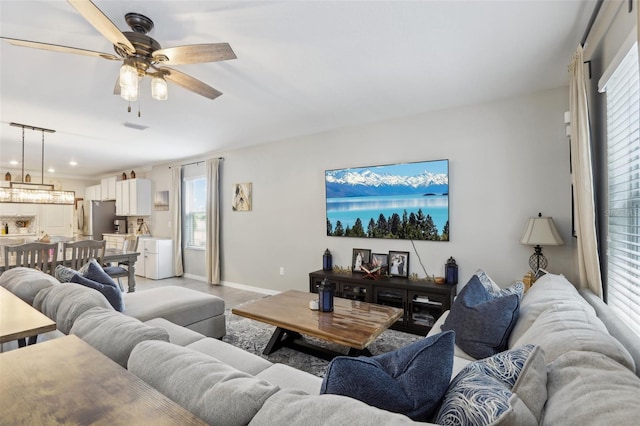 living room featuring ceiling fan