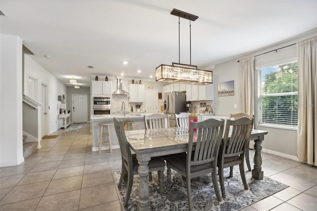 tiled dining area featuring sink