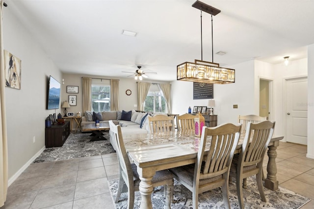 tiled dining room featuring ceiling fan