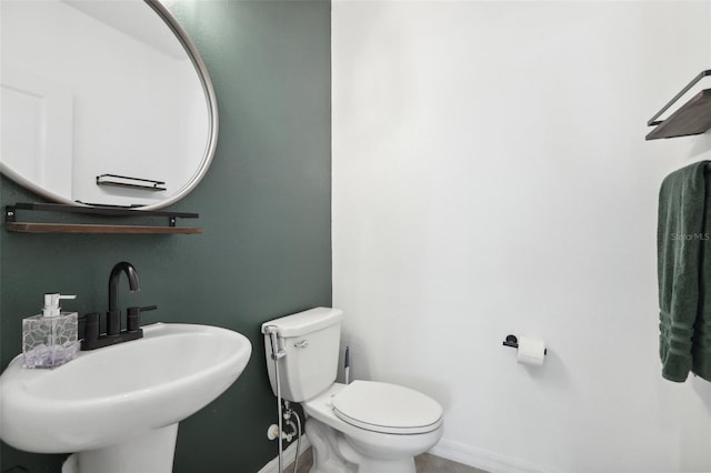 bathroom featuring sink and toilet