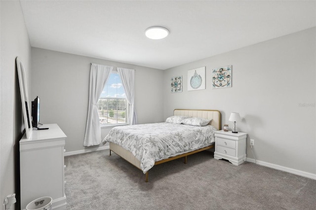 bedroom featuring light colored carpet