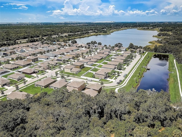 drone / aerial view with a residential view and a water view