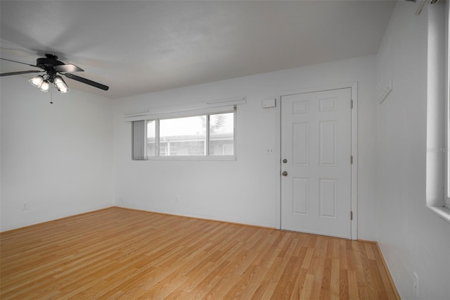 spare room featuring ceiling fan and light hardwood / wood-style flooring