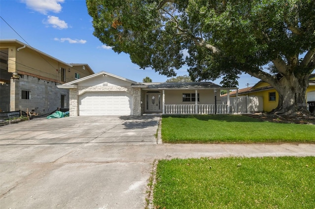 single story home with a front yard, a porch, and a garage