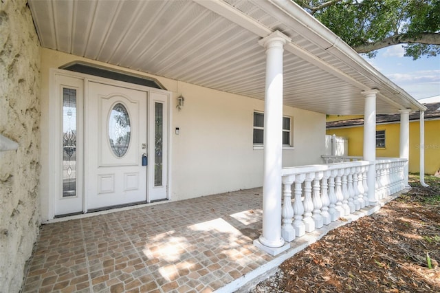 property entrance featuring covered porch