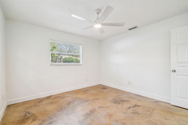 unfurnished room with ceiling fan and carpet