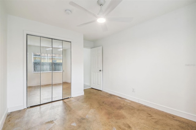 unfurnished bedroom featuring ceiling fan and a closet