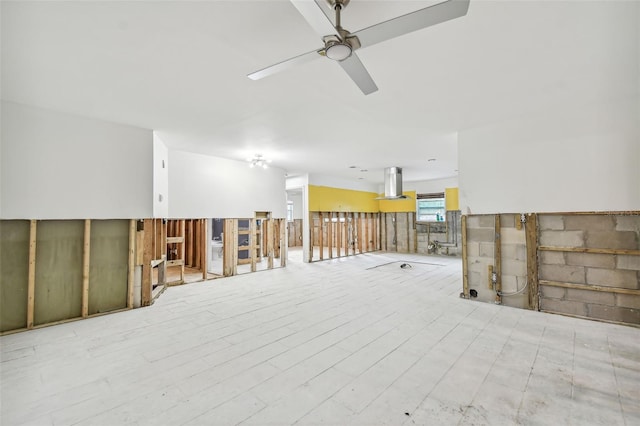 spare room featuring ceiling fan and light hardwood / wood-style flooring