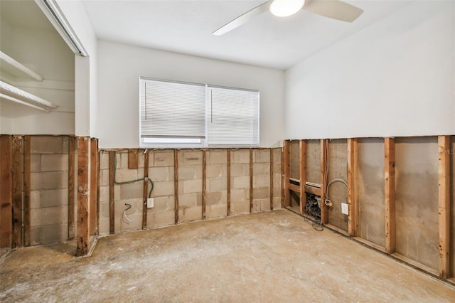 interior space with ceiling fan and concrete floors