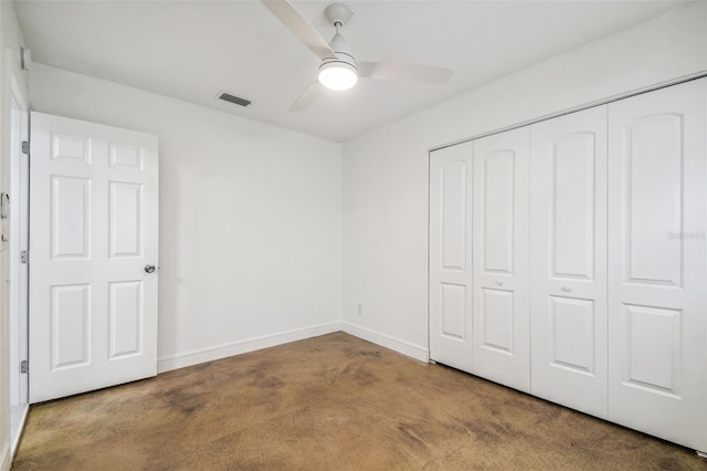 unfurnished bedroom featuring carpet, ceiling fan, and a closet