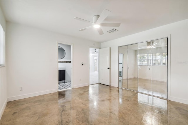 unfurnished room featuring concrete flooring and ceiling fan