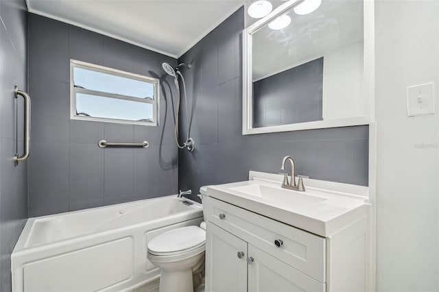 full bathroom with vanity, toilet, and tiled shower / bath