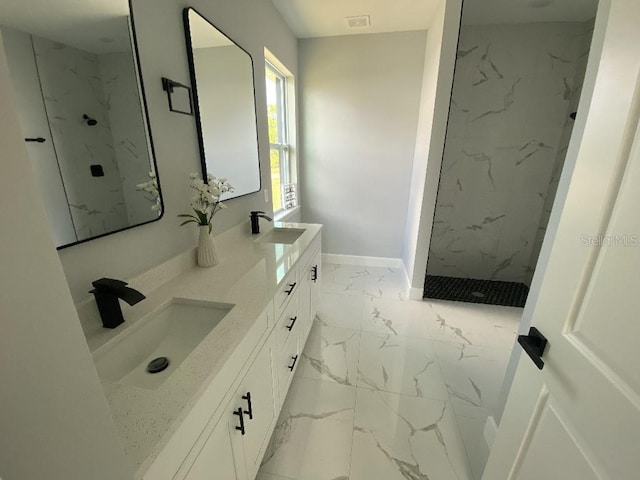 bathroom featuring tiled shower, double vanity, and tile floors